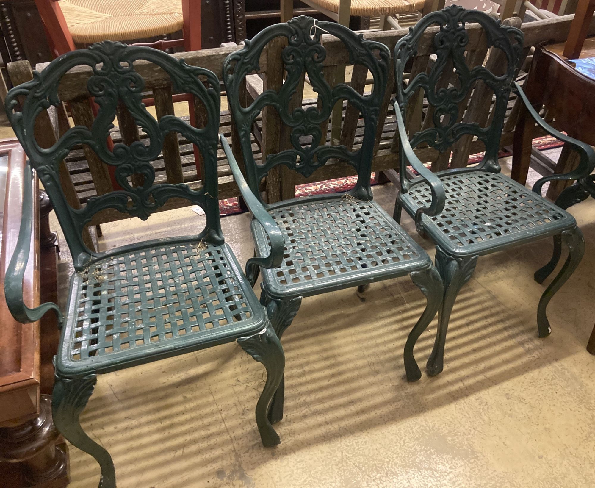 A set of four painted cast aluminium garden chairs (two with arms)